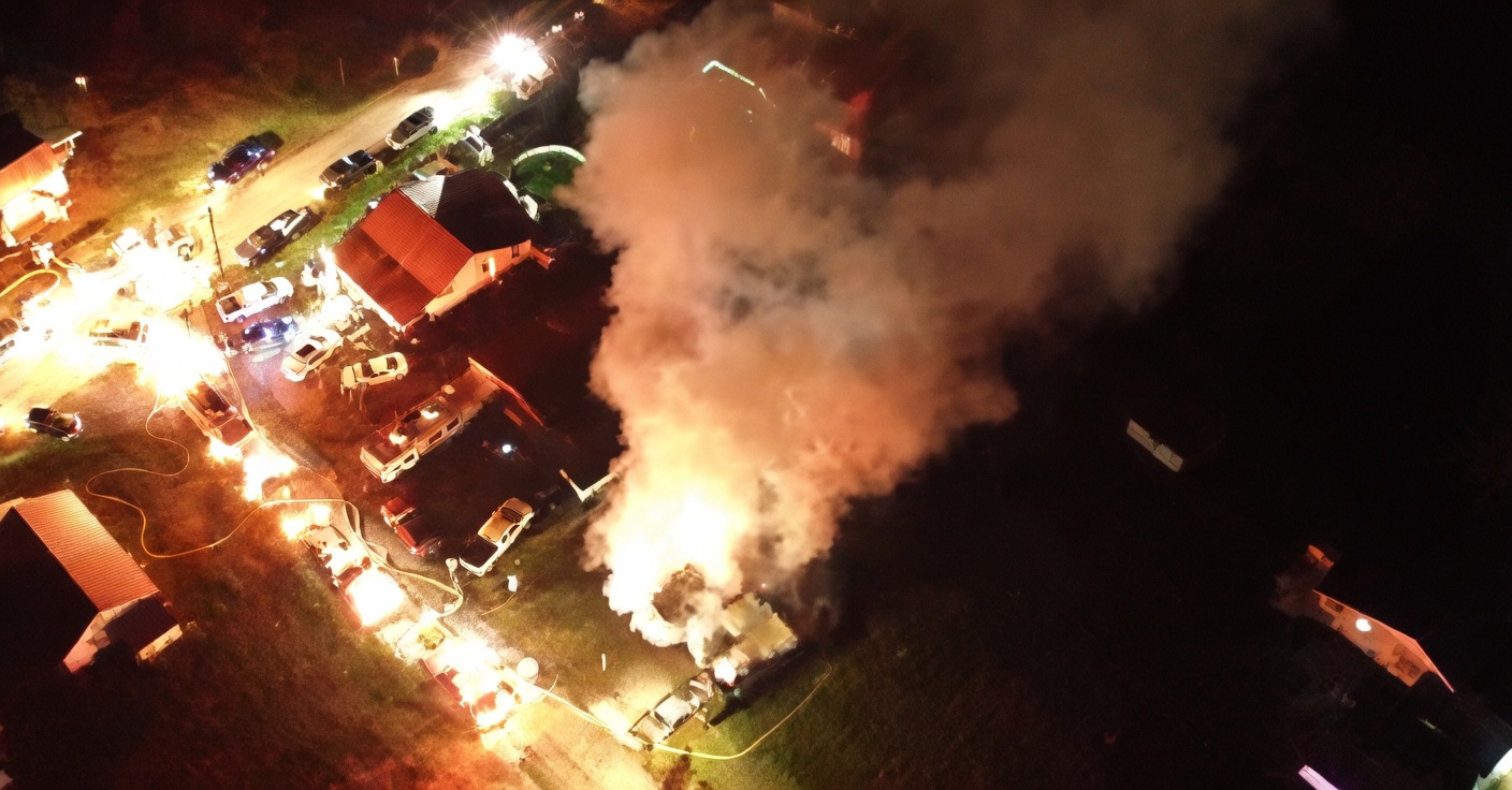 Firefighters battling massive city fire with smoke